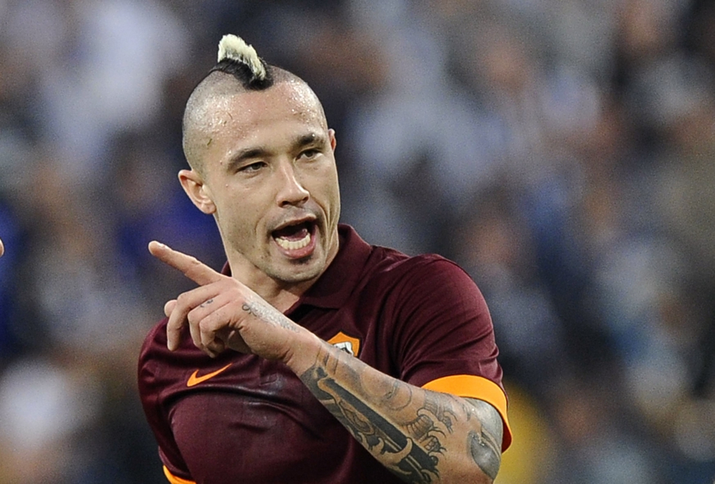 AS Roma's Radja Nainggolan reacts during their Italian Serie A soccer match against Juventus at Juventus Stadium in Turin October 5, 2014. REUTERS/Giorgio Perottino (ITALY - Tags: SPORT SOCCER)